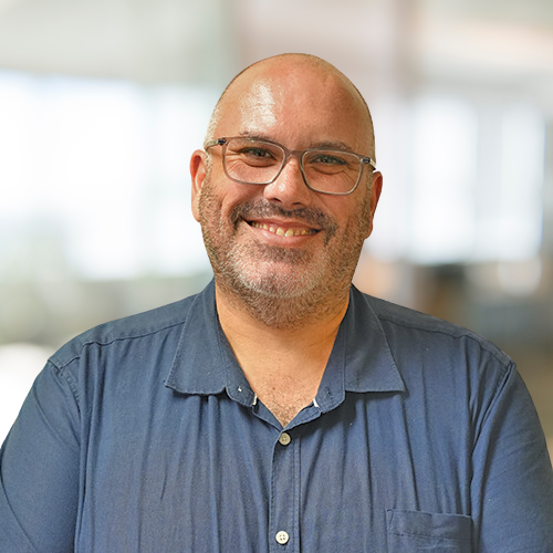 Solicitor Nhulunbuy Mark Clare, head shot smiling, blurred background